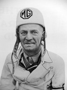 black and white photograph of a man wearing a hat with the letter m on it