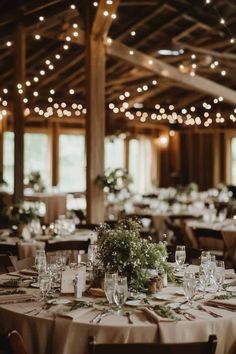 the tables are set with place settings for dinner