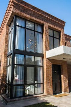 a large brick building with glass windows and doors