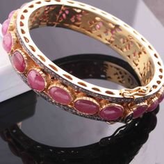 One (1) Pc Beautiful Pave Diamond With Ruby Bangle Bracelet- 925 Sterling Vermeil - Bangle With Lock - Bangle Bracelet BD047 Approx Measurement : Bangles Size: 2.25 inches inside diameter Silver Purity: 925 Metal: Sterling Silver Finish: Vermeil Stone: Ruby, 13mm Sold As: 1 Pc We are continuously adding new products in our store. So keep coming back to see more great deals on gems in our mart. Amazing quality at the best price around!!! Bulk wholesale orders are welcome on this item and any othe Making Handmade Jewelry, Bangle Diamond, Ruby Bangles, Bracelets Silver, Handmade Jewelry Gift, Diamond Bangle, Bracelet Bangle, Pave Diamonds, Bangle Bracelet