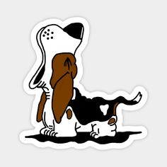 a brown and white dog laying on top of a black and white cat sticker