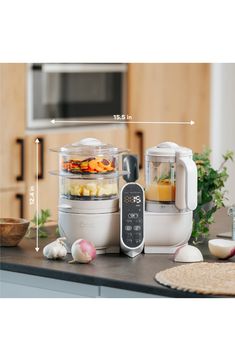 an image of food processor with ingredients on the counter top in front of kitchen appliances