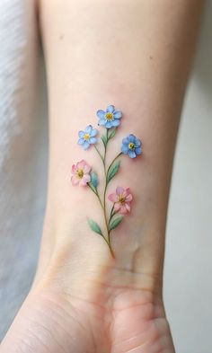 small blue and pink flowers on the wrist