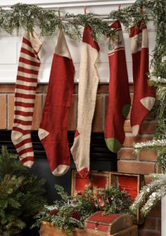 christmas stockings hanging from a fireplace mantel