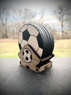 a soccer ball on top of a wooden stand