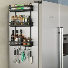 a kitchen with a refrigerator and shelves filled with cooking utensils