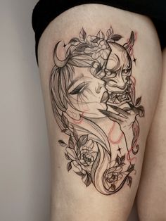 a woman's thigh with a tattoo on it