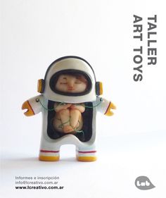 a small figurine of a baby in an astronaut's suit