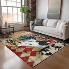 a living room filled with furniture and a painting on the wall