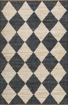 an area rug with black and white squares on it