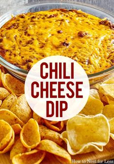 a cheesy dip in a glass dish with chips around it and the words chill cheese dip above it