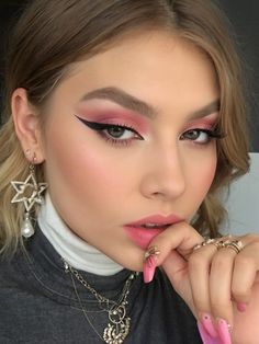 Festival Makeup Ideas #festivalmakeup #makeup #makeupgoals #makeupoftheday #makeuplover #makeupaddict #festivalstyle Pink Eye Makeup Festival, Pink Glitter Festival Makeup, Pink Graphic Eyeliner Looks, Pink Graphic Makeup Looks, Pink Glitter Rave Makeup