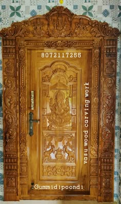 an ornate wooden door with carvings on it