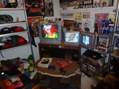 two televisions sitting on top of a wooden table in a room filled with toys