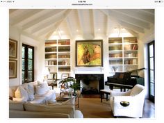 a living room filled with furniture and a piano