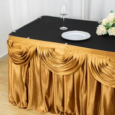 The divine luster of premium quality satin coupled with the intricate craftsmanship gives this breathtaking decorative accessory to transform your ordinary table covers and party tables into royal tablescapes. Table Skirting, Display Cake, Table Skirts, Prom Decor, Party Tables, Craft Fair Displays, Table Skirt, Dessert Tables, Banquet Tables