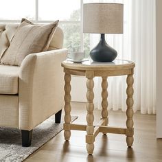 a living room scene with focus on the end table and lamp in the foreground