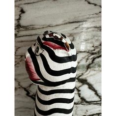 a zebra print bag sitting on top of a marble counter