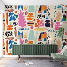 a living room with an abstract wallpaper and green chair in front of the radiator