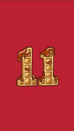 the letter i made out of waffles on a red background with gold foil