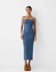 Long strappy denim dress. Available in blue, light blue. Long Denim Dress, Strapless Denim Dress, Bodysuits And Jeans, Blue Denim Dress, Denim Maxi Dress, Womens Denim Dress, Baggy Trousers, Strappy Dresses, Jumpsuit Trousers