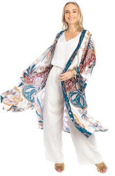 Love to layer all of your look in this bohemian-inspired duster that is covered in a bright medallion pattern. Open front Short sleeves 100% rayon Hand wash, line dry Imported Model stats: 5'10", 32" bust, 25" waist, 36" hip. Model is wearing size One Size. Kimonos, Paisley Kimono, Duster Kimono, Kimono Duster, Medallion Pattern, Dusters, Floral Elements, Fabric Belt, Mixing Prints