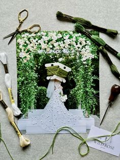 the wedding photo is surrounded by flowers and scissors