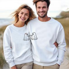 Embroidered Couples Halloween Cute Ghost Sweater,Ghosts Couple Embroidered Sweatshirt,Halloween Matching Couples Hoodies,Spooky Couple Sweat 👕How To Order👕 1-) Please, check and review all photos 2-) Choose your t-shirt size and color 3-) Click add to cart. You can go back to add more product 4-)Click "Proceed to check out" 5-)When you check out, you can add a note to seller for any request PRODUCT FEATURES Unisex Sweatshirt 50% Cotton, 50% Polyester CARE INSTRUCTIONS Wash item inside out in c Halloween White Embroidered Sweatshirt, Halloween Embroidered Crew Neck Hoodie, White Halloween Hoodie Long Sleeve, White Long Sleeve Halloween Hoodie, White Halloween Hoodie, White Long Sleeve Hoodie For Halloween, White Long Sleeve Halloween Sweatshirt, Matching Couples Hoodies, Spooky Couple