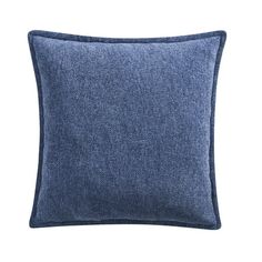 the blue denim pillow is shown on a white background, it has a dark blue border and