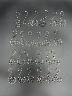 a metal plate with numbers and symbols on the bottom, as well as an odd shape