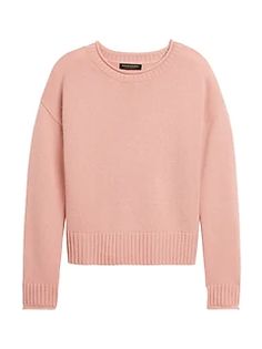 a pink sweater is shown from the front