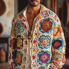 a man wearing a colorful crochet jacket