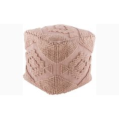 a pink knitted poufce with intricate designs on the top and bottom, sitting in front of a white background