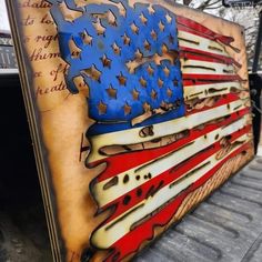 an american flag painted on the side of a building