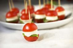 small appetizers with toothpicks in the shape of tomatoes