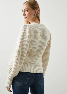 The ultimate transition sweater, Romy is warm and cozy with a touch of detailing. Made from a soft cotton blend and complete with crocheted daisies throughout. Details: Crew Neckline Long Sleeve 84% Cotton, 16% Nylon. Hand wash cold separately. Do not bleach. Lay flat to dry. Cool iron if needed. Imported. Recommend ordering true to size. Front Body Length: 20 3/4" (Measured from Small) Crochet Daisy Sweater, Crochet Daisies, Daisy Sweater, Denim Sweater Jacket, Thermal Sweater, Crochet Daisy, Denim Sweater, Denim Accessories, Poplin Shirt