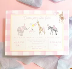 a pink and white baby shower card with animals on it