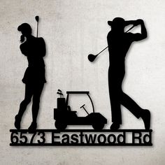 the silhouettes of two people playing golf on a sign that says, 557 eastwood rd