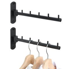 two wooden clothes hangers and one black coat rack