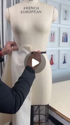 a man is working on a mannequin