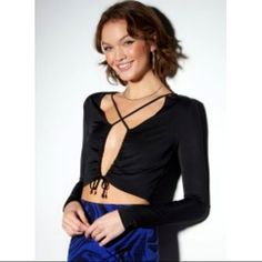 A Party Girl Necessity. Flirty Long Sleeve Top Featuring An Open Front Fastened With A Drawstring Cinched Cutout And Crisscross Straps Across The Chest. Bin 106 Ruched Long Sleeve Crop Top For Party, Long Sleeve Ruched Crop Top For Party, Chic Cross-tied Crop Top For Night Out, Ruched Stretch Crop Top For Party, Fitted Crisscross Crop Top For Night Out, Fitted Cross-tied Crop Top For Night Out, Trendy Ruched Party Tops, Party V-neck Ruched Tops, Black Ruched Crop Top For Party