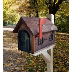 a mailbox in the shape of a house