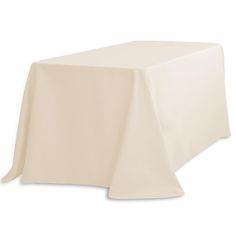 a white table cloth on top of a wooden table