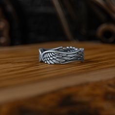 Handmade Sterling Silver Angel Wings Men Wedding Ring, Angel Wings Silver Men Jewelry, Wing Men Wedding Band, Statement Ring, Promise Ring * Gender : Female & Male     *  Stamp: 925 Sterling Silver  * Finish: Oxidized - Polished - Gold Plated - PRODICT DETAILS - * Ring Diameter: 1,00 Cm ( 0,39 Inches ) * Ring Weight: 09-10 Grams * Ring Size: 5 US to 15 US  ADVICES  '' * All our products are handmade and weights may vary  (-) 1,00 gram ( For USA Ring Size 11 ) * We recommend using the oxidized ve Men Wedding Band, Silver Angel Wings, Detailed Ring, Men Jewelry, Ring Promise, Mens Wedding Rings, Silver Man, Mens Wedding Bands, Handmade Sterling Silver