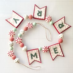 a close up of a number made out of felt beads and fabric decorations on a table