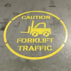 caution forklift traffic sticker on the side of a vehicle