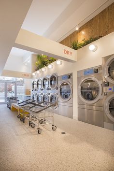 the laundry room is clean and ready for us to use in their new business, dryer