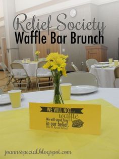 there is a sign on the table that says relief society waffle bar brunch