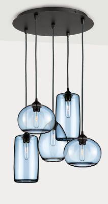 four glass vases hanging from a ceiling fixture with black metal fittings and clear glass shades