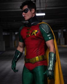 a man in a green and red costume